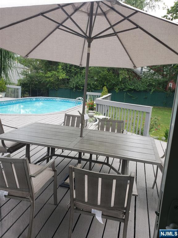 21 A Millar Court Paramus, NJ 07652 - Photo 22 of 24 a view of table and chairs under an umbrella