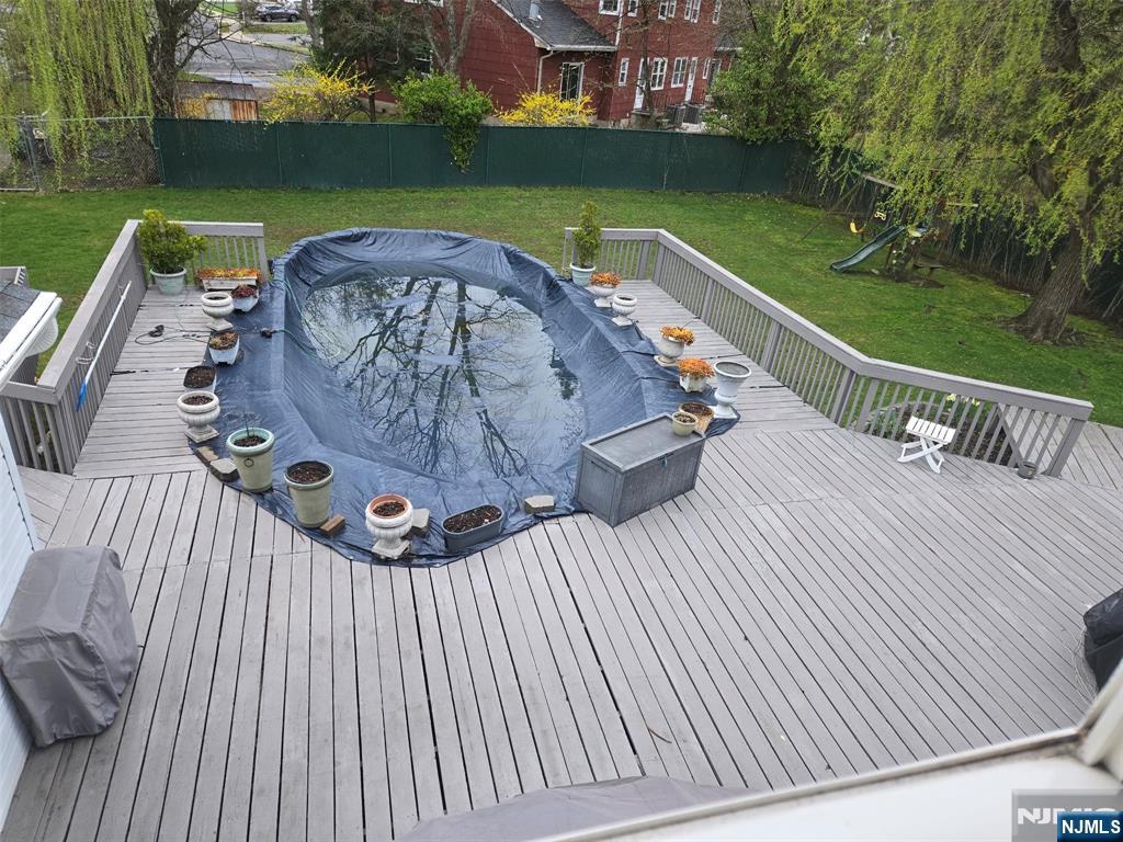21 A Millar Court Paramus, NJ 07652 - Photo 23 of 24 a view of a swimming pool with a patio