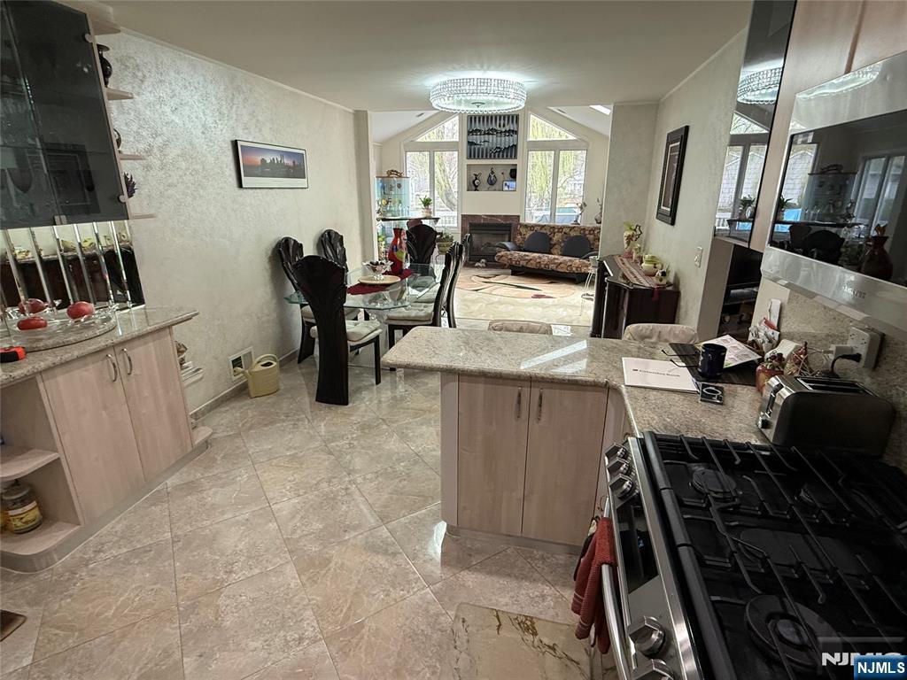 21 A Millar Court Paramus, NJ 07652 - Photo 3 of 24 a kitchen with sink refrigerator and stove