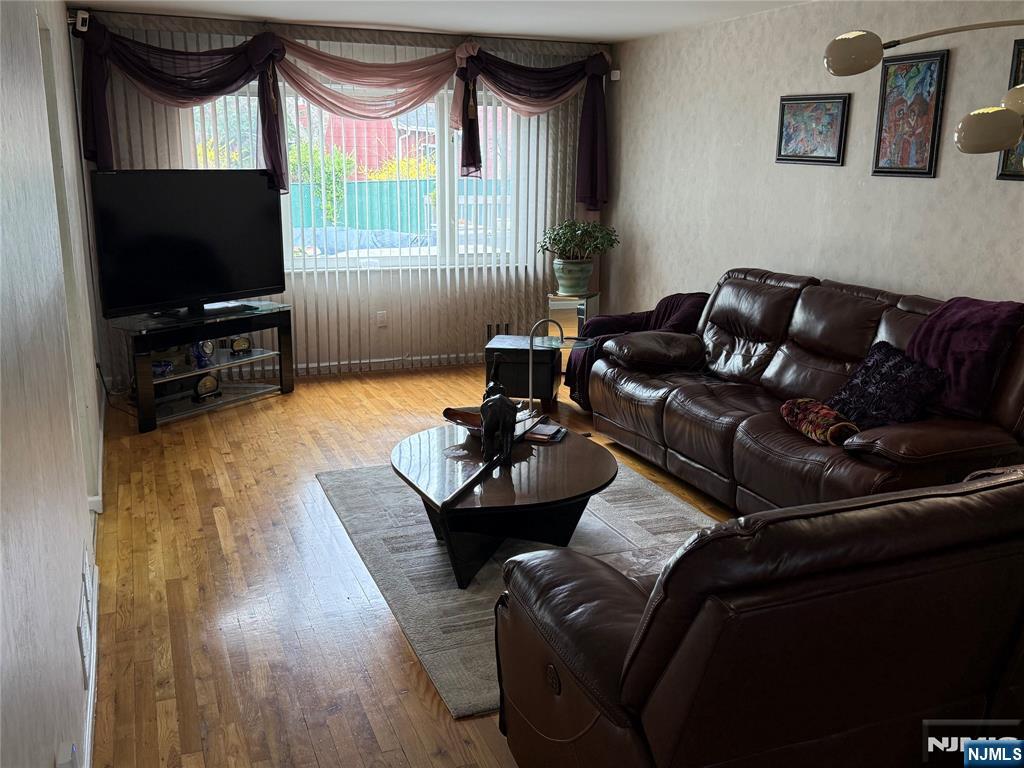 21 A Millar Court Paramus, NJ 07652 - Photo 6 of 24 a living room with furniture and a flat screen tv