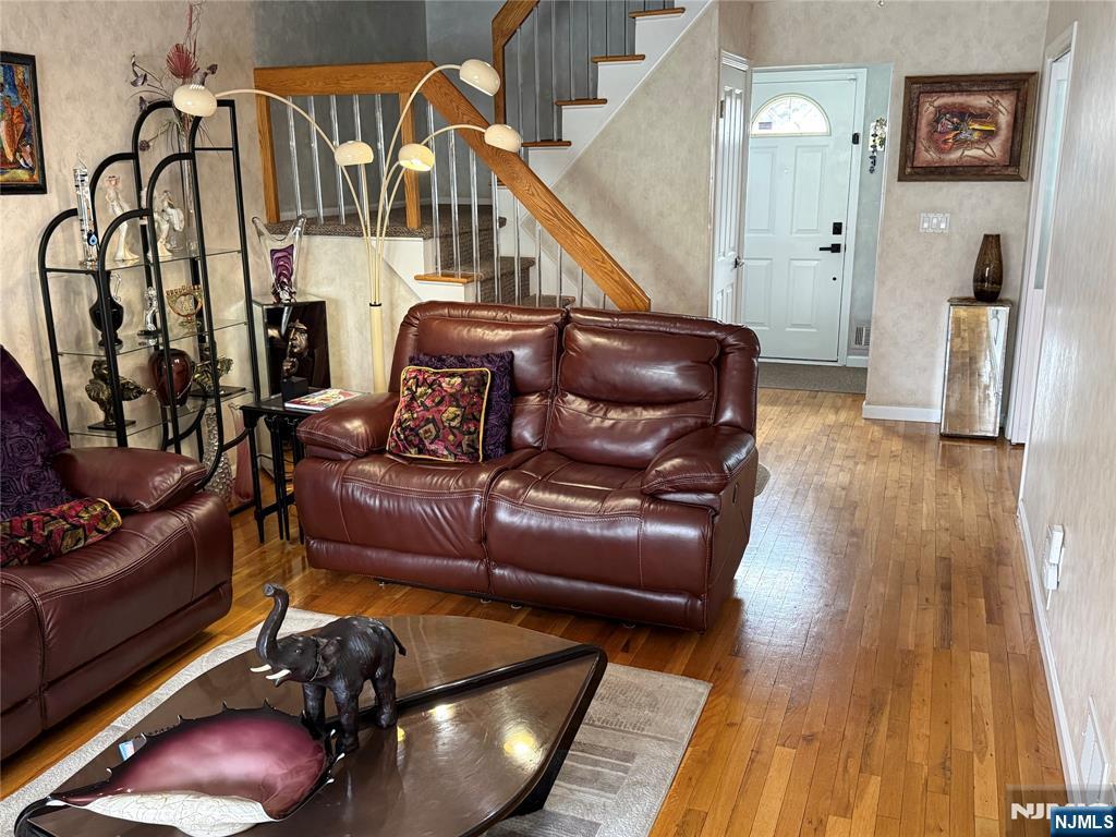 21 A Millar Court Paramus, NJ 07652 - Photo 7 of 24 a living room with furniture and a wooden floor