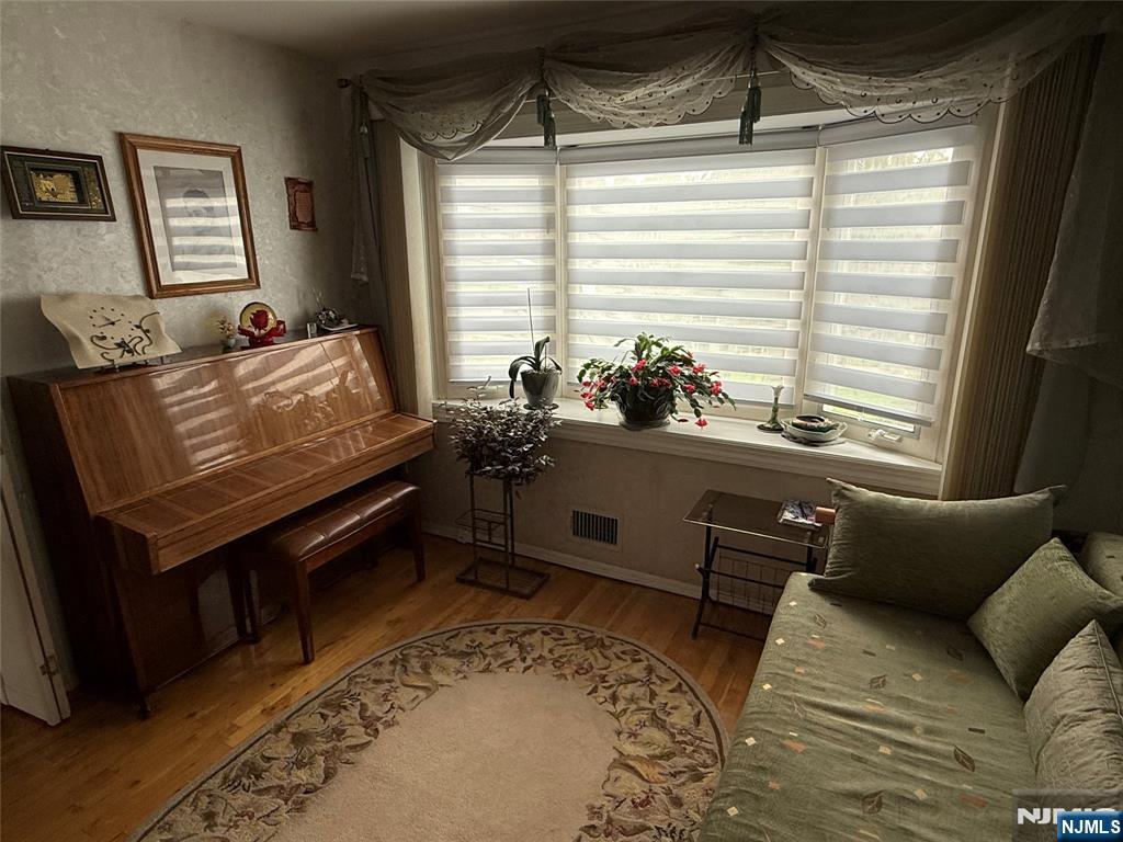 21 A Millar Court Paramus, NJ 07652 - Photo 9 of 24 a living room with furniture and a window