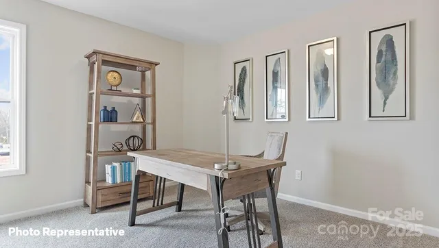 a view of a livingroom with furniture and window