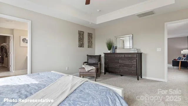 a bedroom with a bed and a cabinets