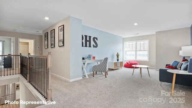 a living room with furniture and white walls