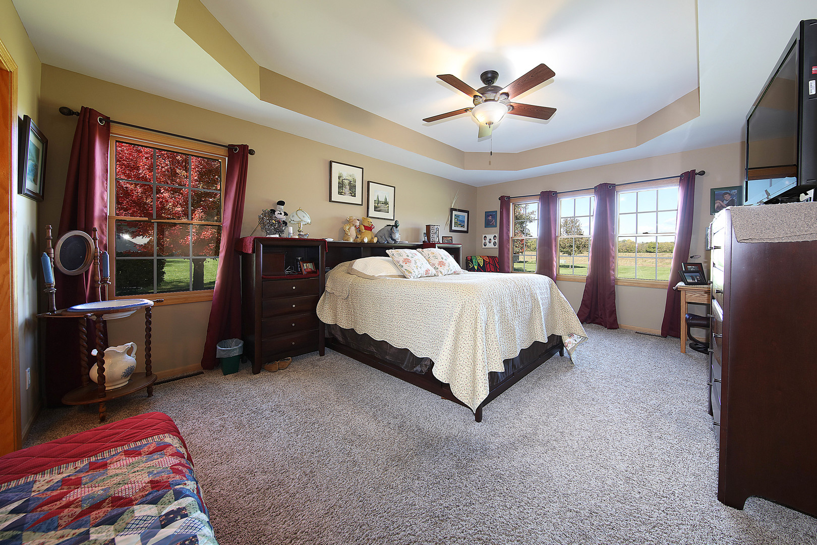 700 East Southmor Road Morris, IL 60450 - Photo 12 of 22 a bedroom with a bed and a flat tv screen on dresser
