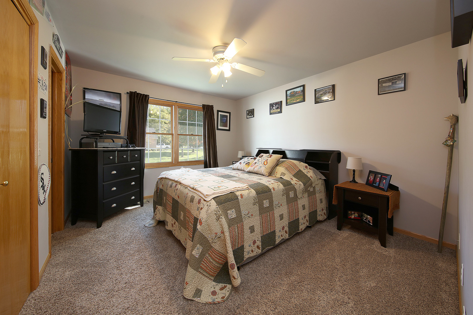 700 East Southmor Road Morris, IL 60450 - Photo 16 of 22 a bedroom with a bed and a flat tv screen on dresser