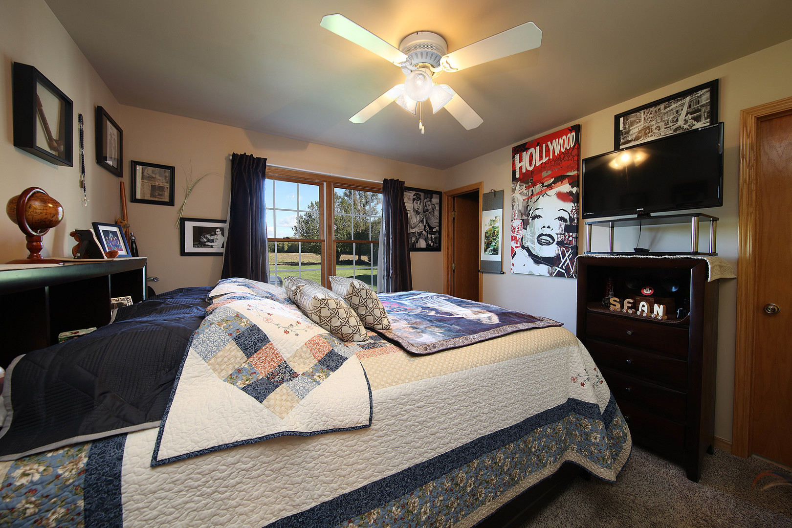 700 East Southmor Road Morris, IL 60450 - Photo 18 of 22 a bedroom with a bed and a flat screen tv