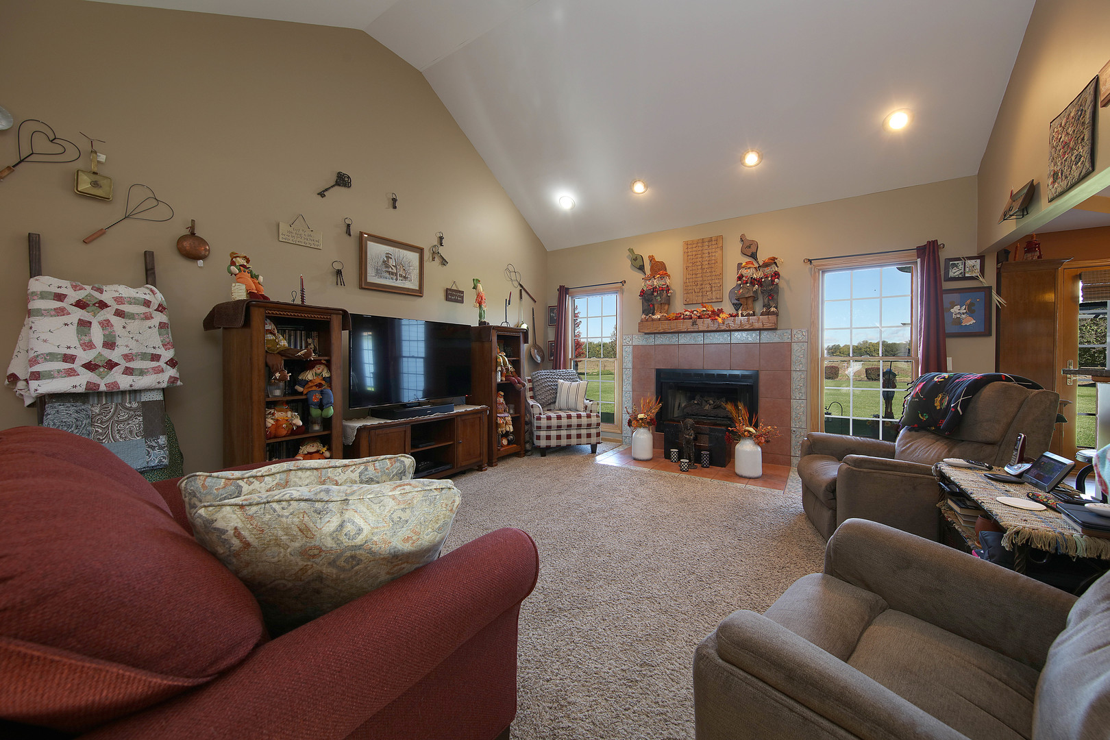 700 East Southmor Road Morris, IL 60450 - Photo 6 of 22 a living room with furniture a fireplace and a flat screen tv