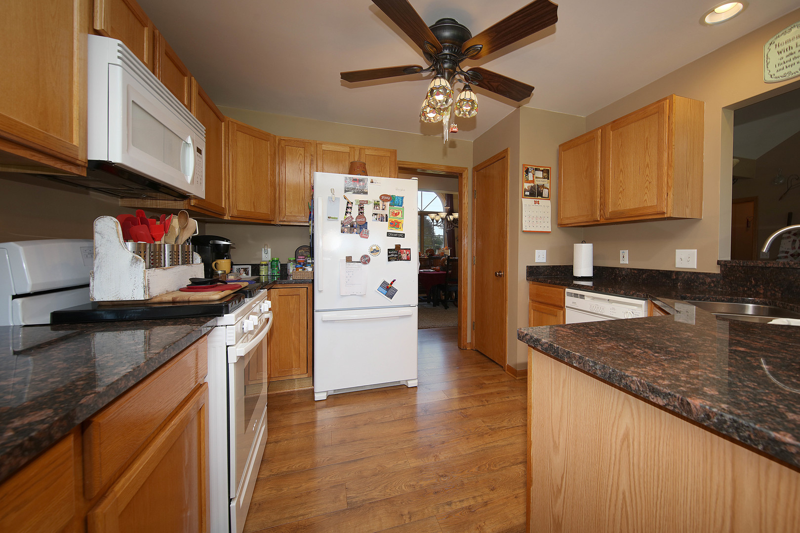 700 East Southmor Road Morris, IL 60450 - Photo 8 of 22 a kitchen with stainless steel appliances granite countertop a sink stove and refrigerator