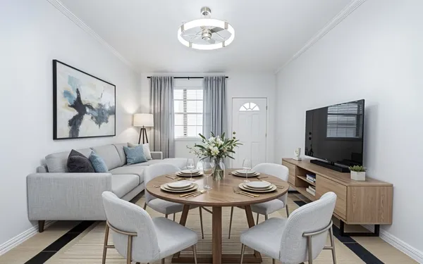 a view of a dining room with furniture and a flat screen tv