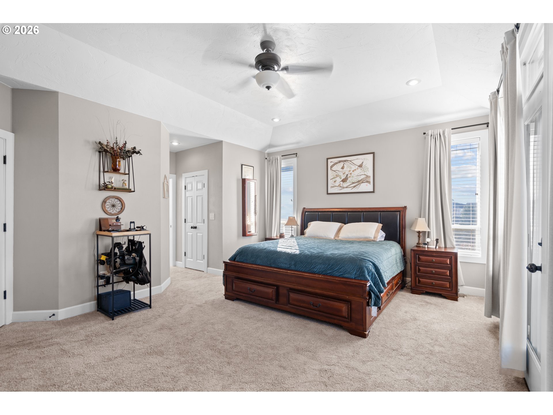 1741 Southwest 18th Street Pendleton, OR 97801 - Photo 15 of 38 a spacious bedroom with a bed and a ceiling fan