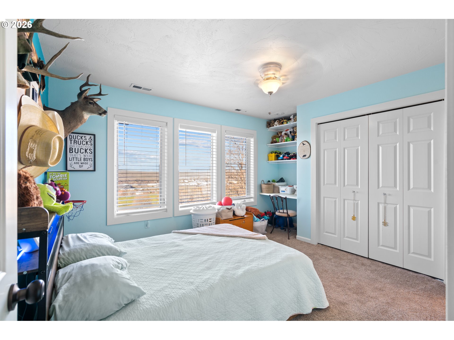 1741 Southwest 18th Street Pendleton, OR 97801 - Photo 22 of 38 a bedroom with a bed and a chandelier