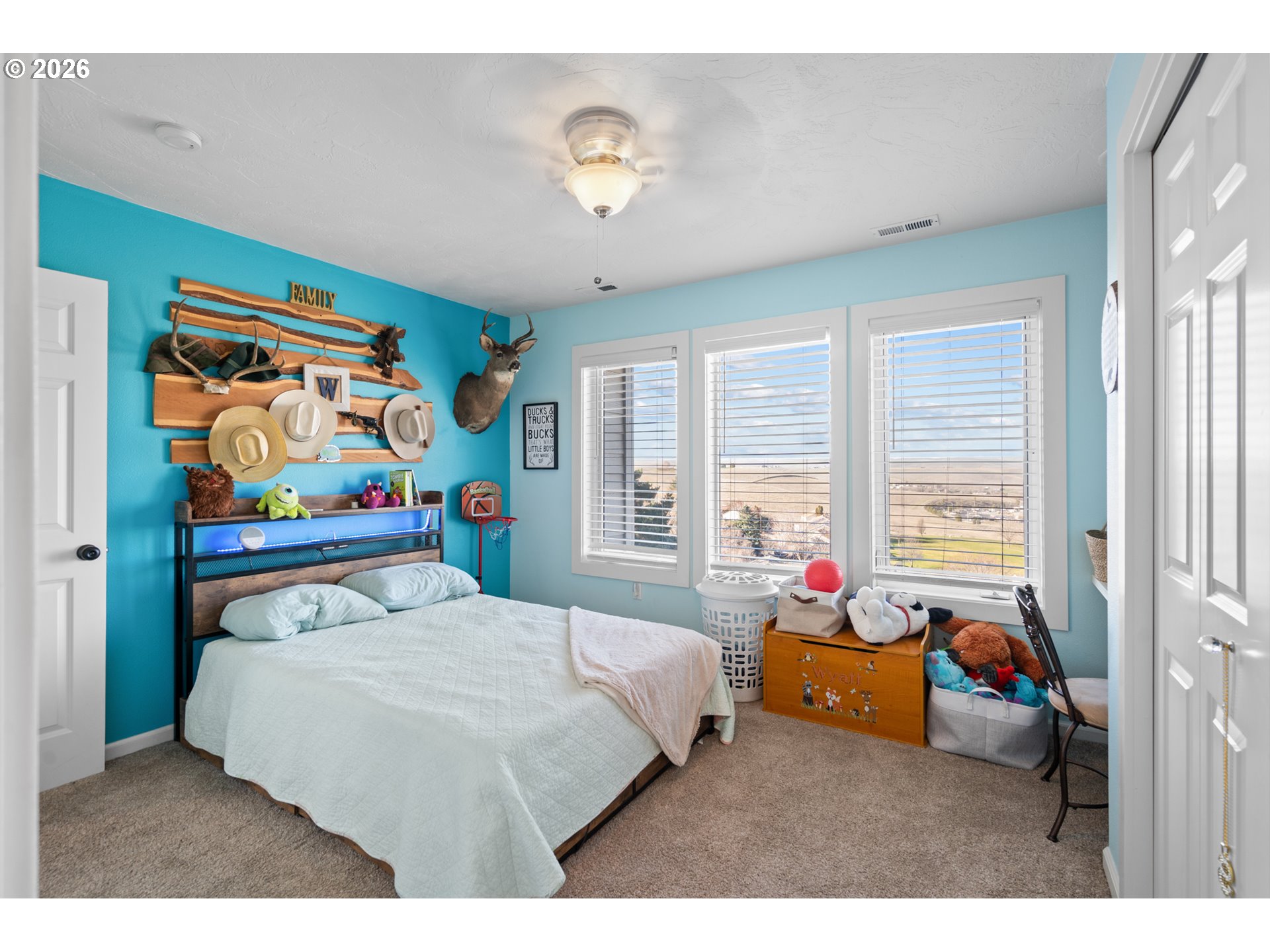 1741 Southwest 18th Street Pendleton, OR 97801 - Photo 23 of 38 a bedroom with a bed and large windows