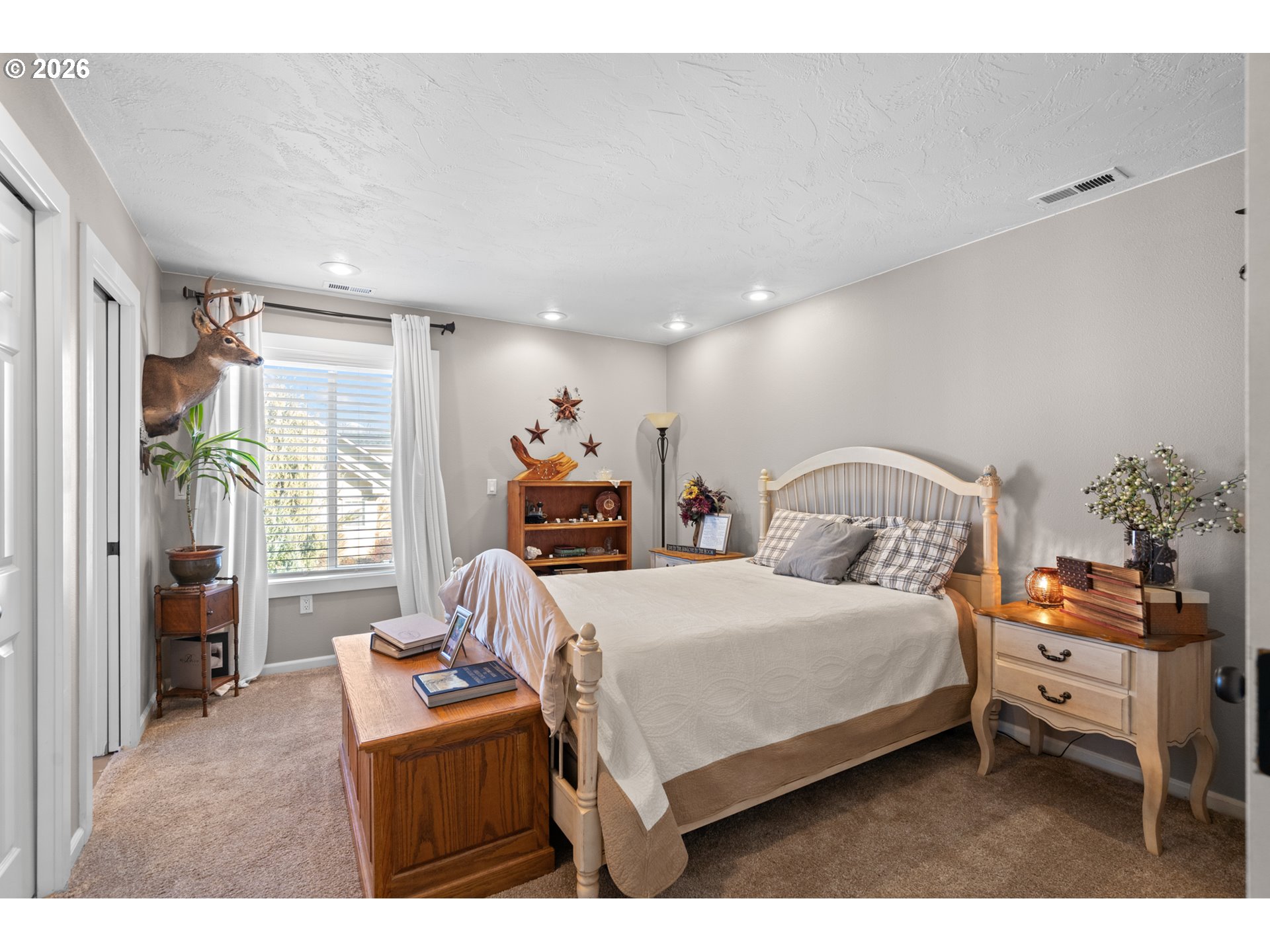 1741 Southwest 18th Street Pendleton, OR 97801 - Photo 25 of 38 a bedroom with a bed and a potted plant on the dresser
