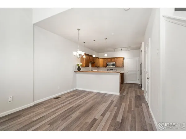 a view of kitchen with wooden floor