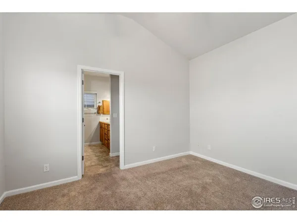 a view of an empty room and fire place