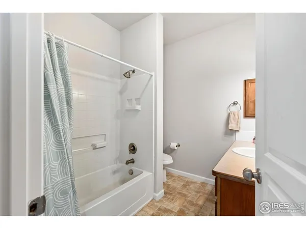 a bathroom with a sink double vanity granite and a mirror