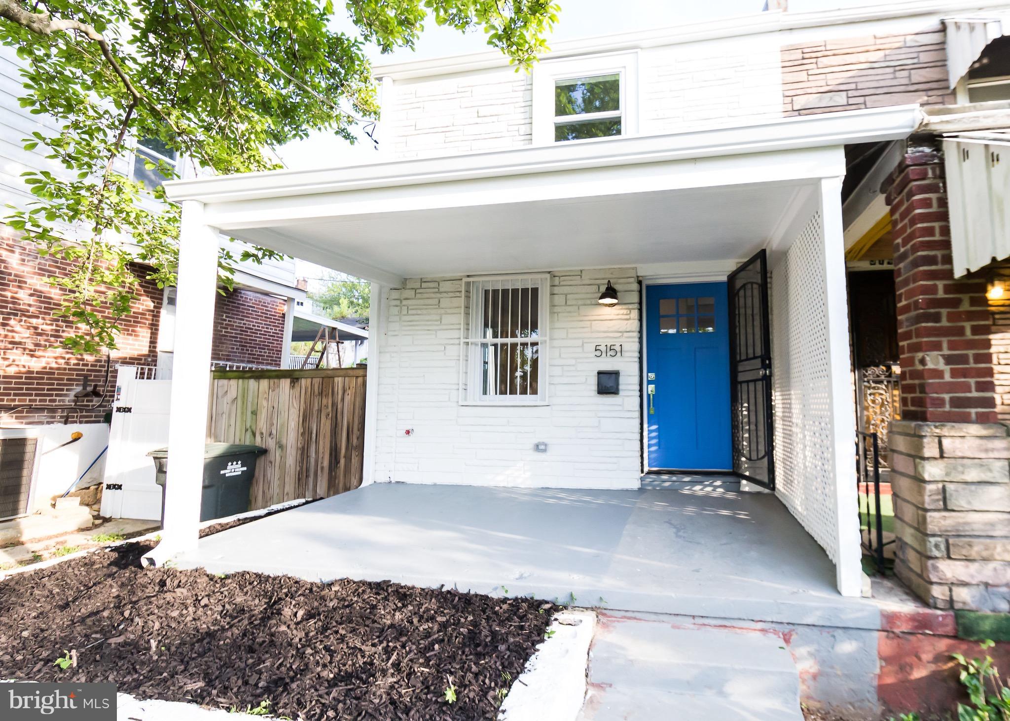 5151 Sheriff Road Northeast Washington, DC 20019 - Photo 1 of 20 a front view of a house with a garage