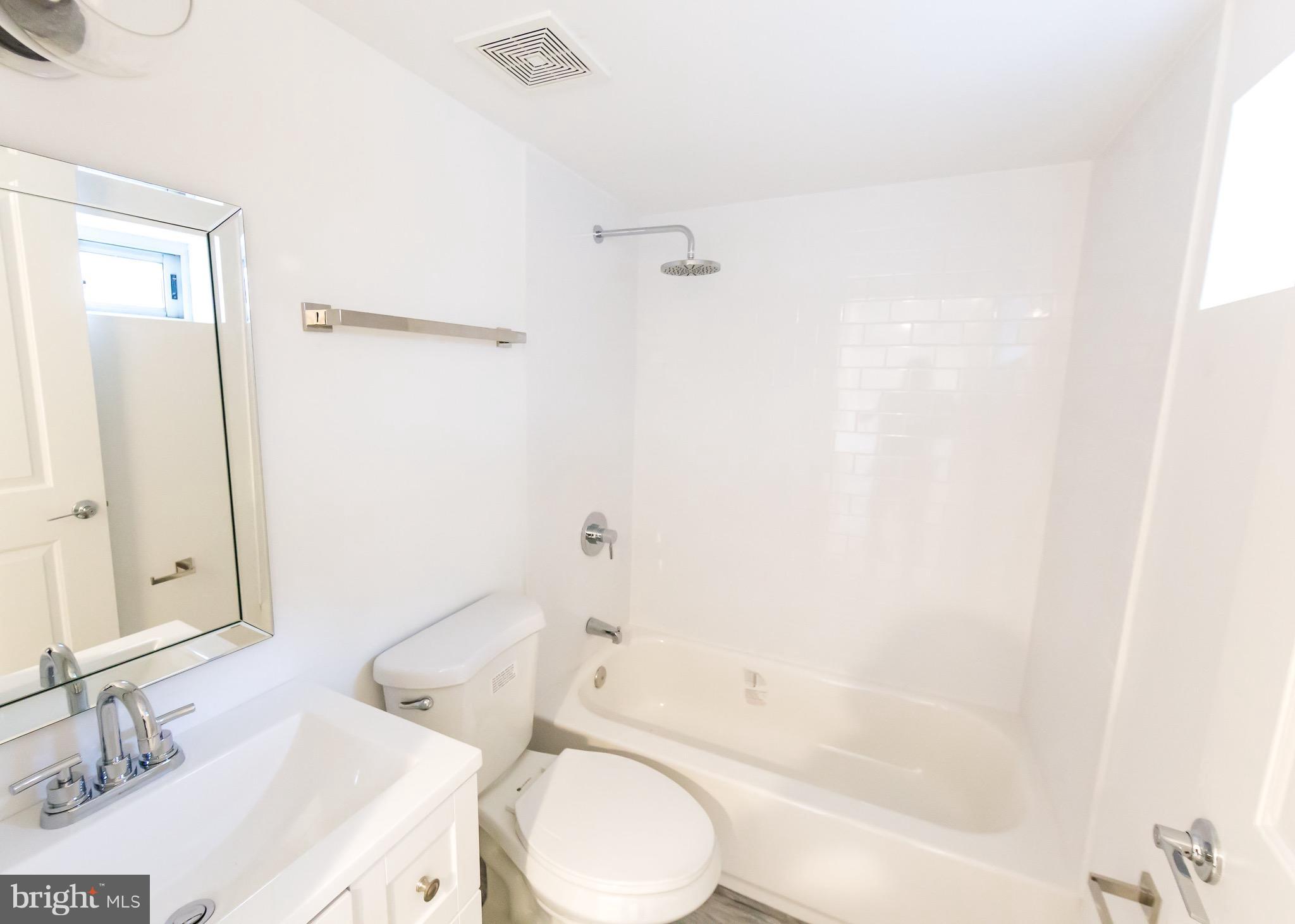 5151 Sheriff Road Northeast Washington, DC 20019 - Photo 18 of 20 a bathroom with a sink toilet and shower