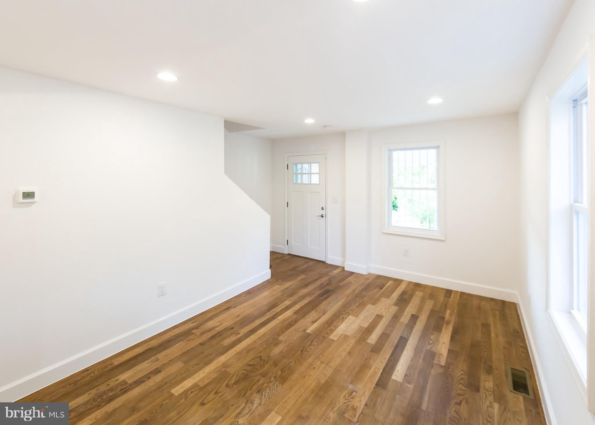 5151 Sheriff Road Northeast Washington, DC 20019 - Photo 3 of 20 a view of empty room with wooden floor