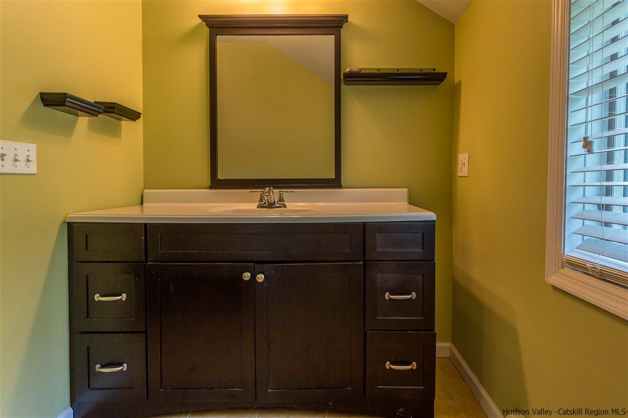 226 Rickey Road Stone Ridge, NY 12484 - Photo 17 of 17 a bathroom with a sink and a mirror