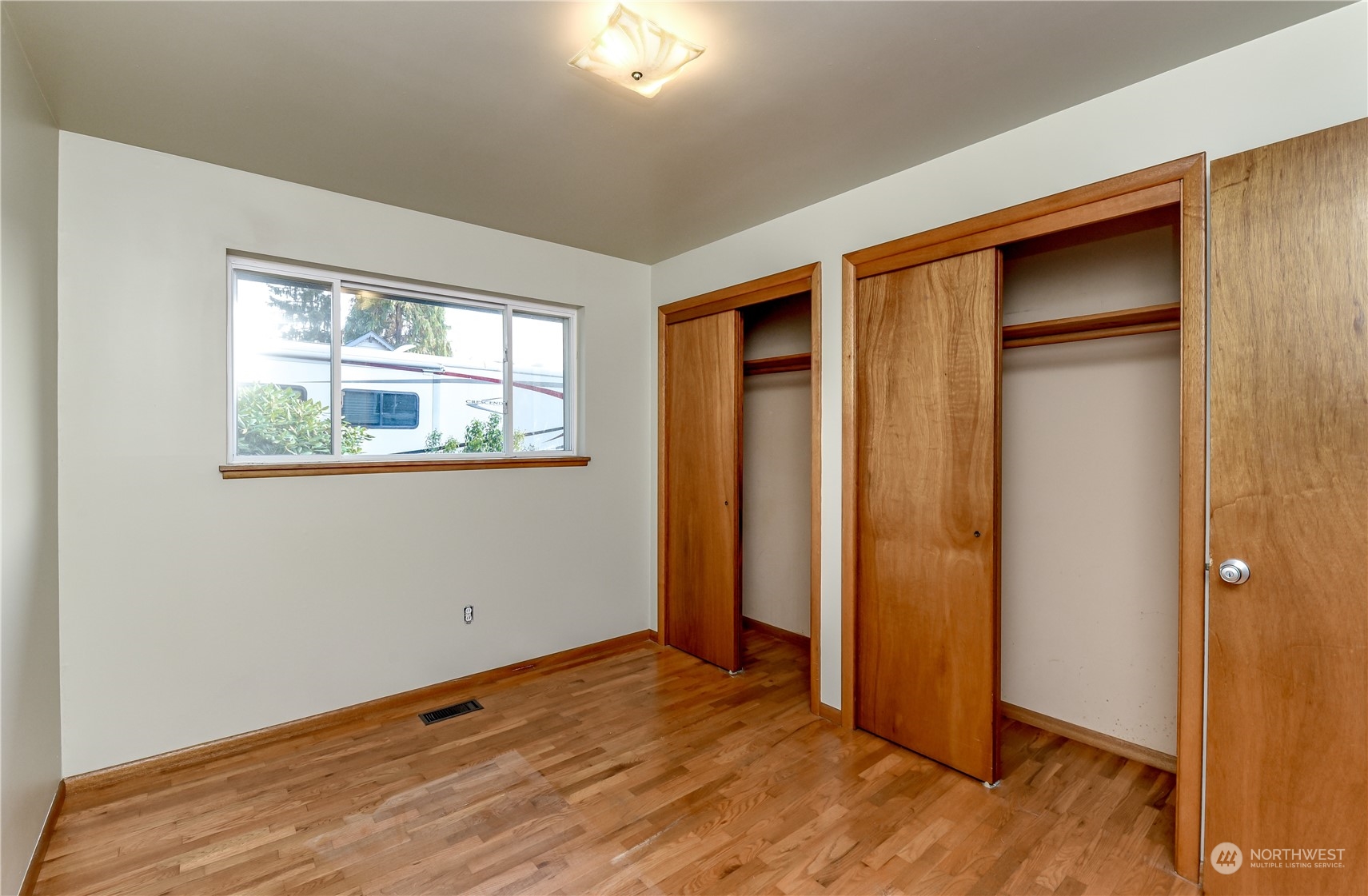 272 Hinkleman Road Buckley, WA 98321 - Photo 22 of 37 an empty room with wooden floor and a window