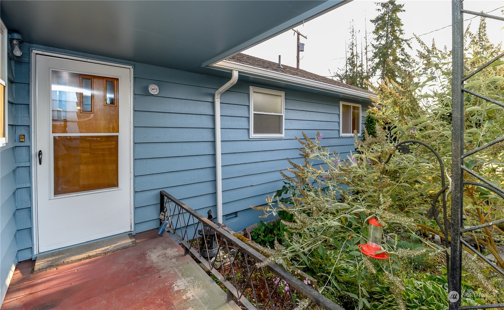 272 Hinkleman Road Buckley, WA 98321 - Photo 3 of 37 a view of house with wooden fence and potted plants