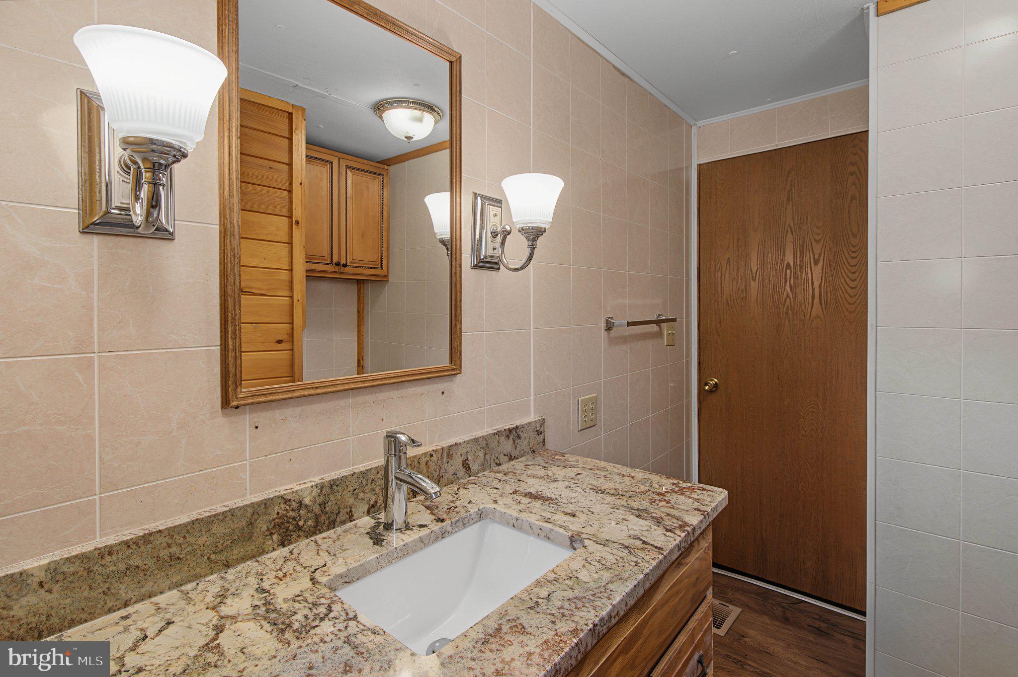 2165 Jennings Road Jennings, MD 21536 - Photo 25 of 28 Elegant bathroom with modern finishes.