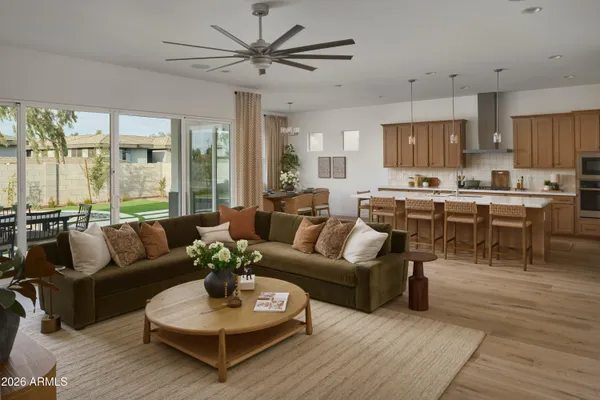 a kitchen with sink cabinets and living room