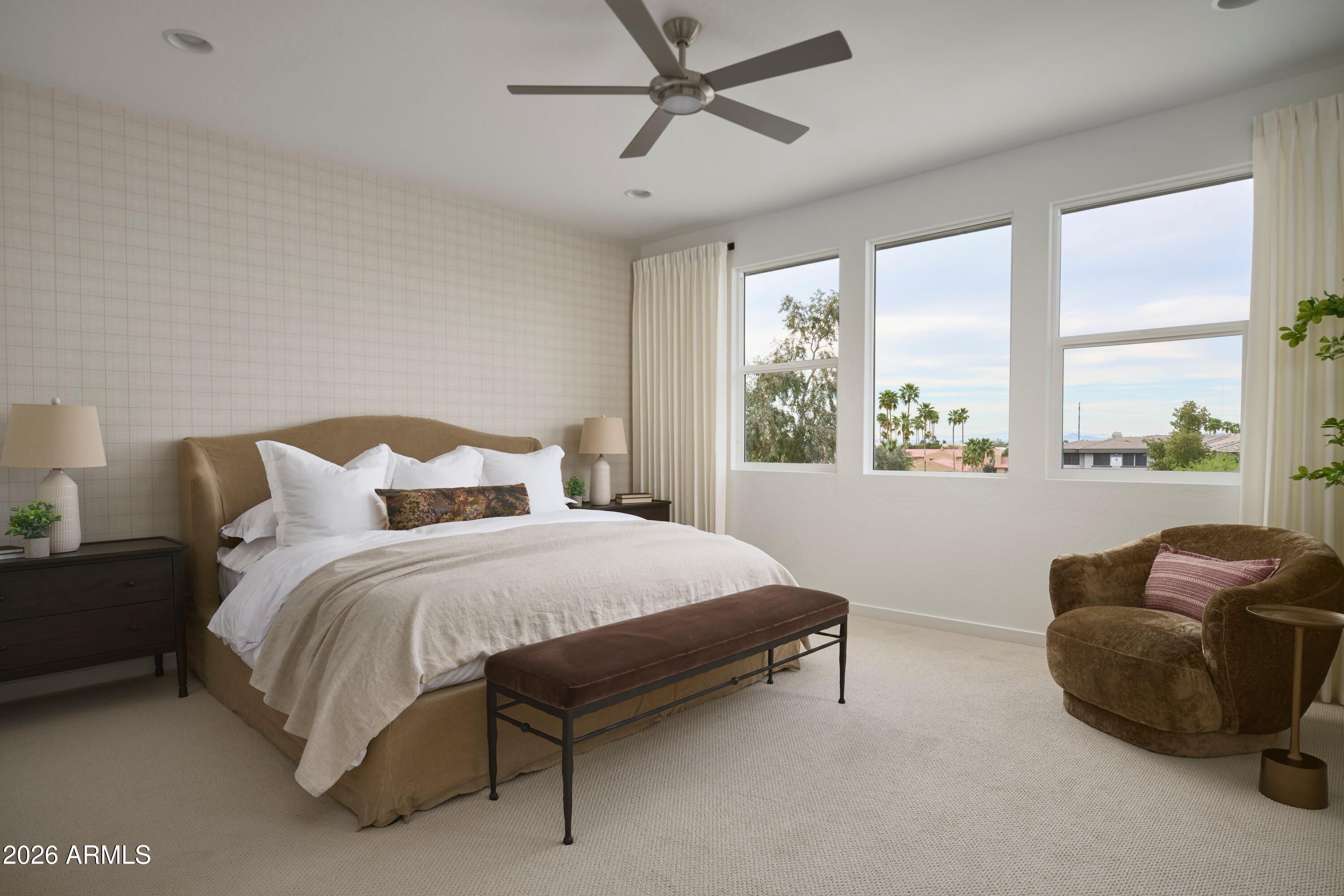 3705 East Constance Way Phoenix, AZ 85042 - Photo 7 of 10 a bedroom with a bed and a couch