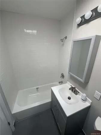 a bathroom with a sink a toilet and a bathtub