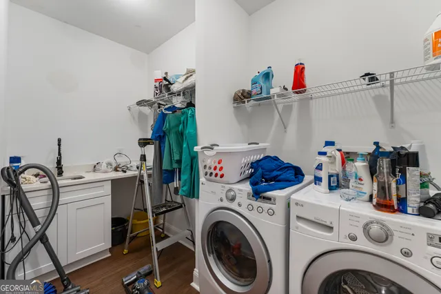a view of storage and utility room with washer and dryer