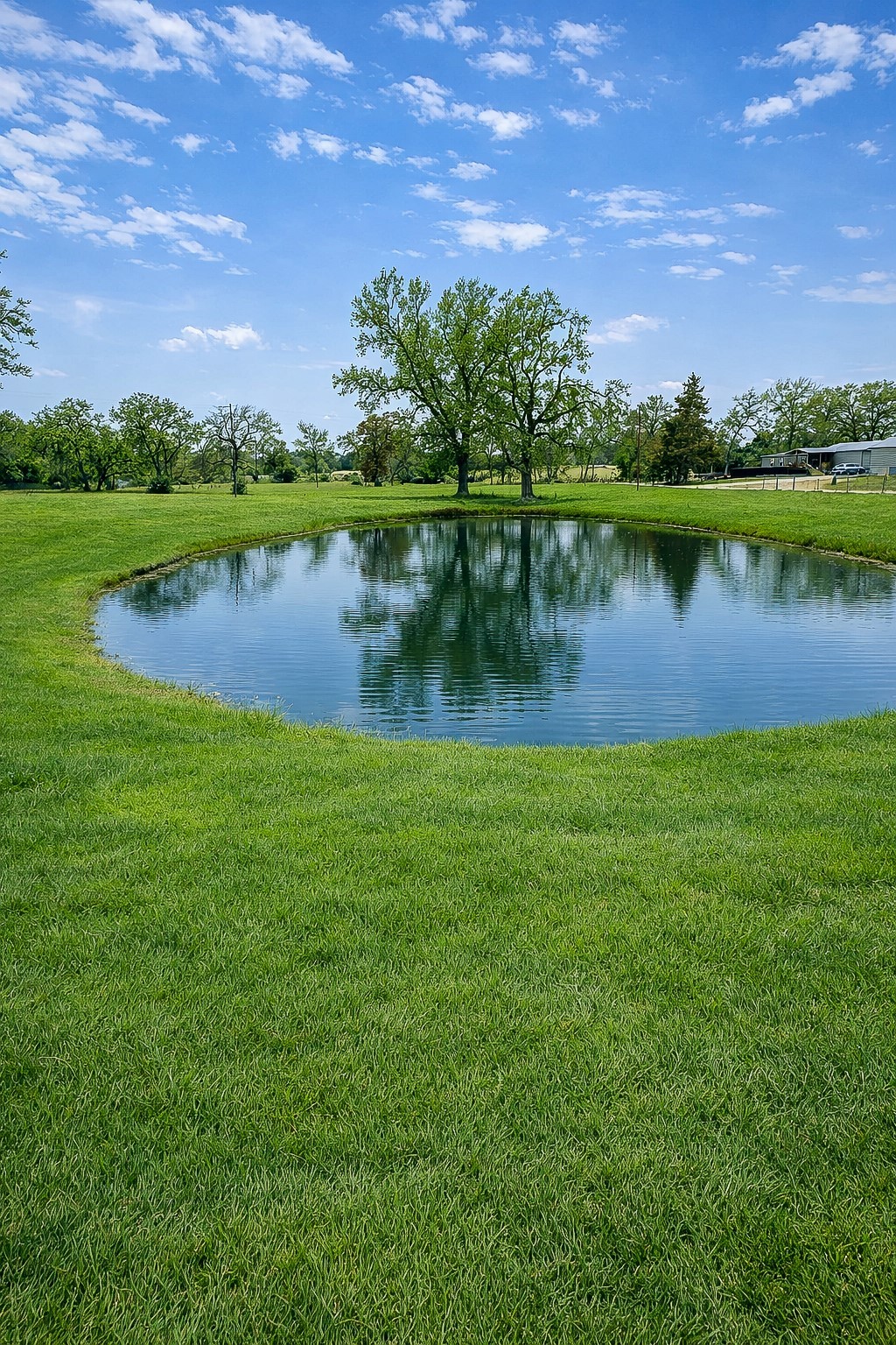 7031 Red Rock Road Franklin, TX 77856 - Photo 16 of 17 a view of a lake with houses in the back