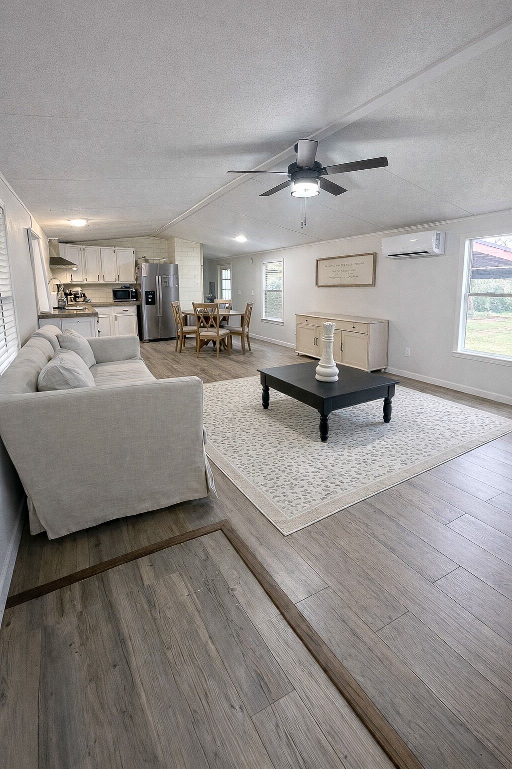 7031 Red Rock Road Franklin, TX 77856 - Photo 5 of 17 a living room with furniture and a wooden floor