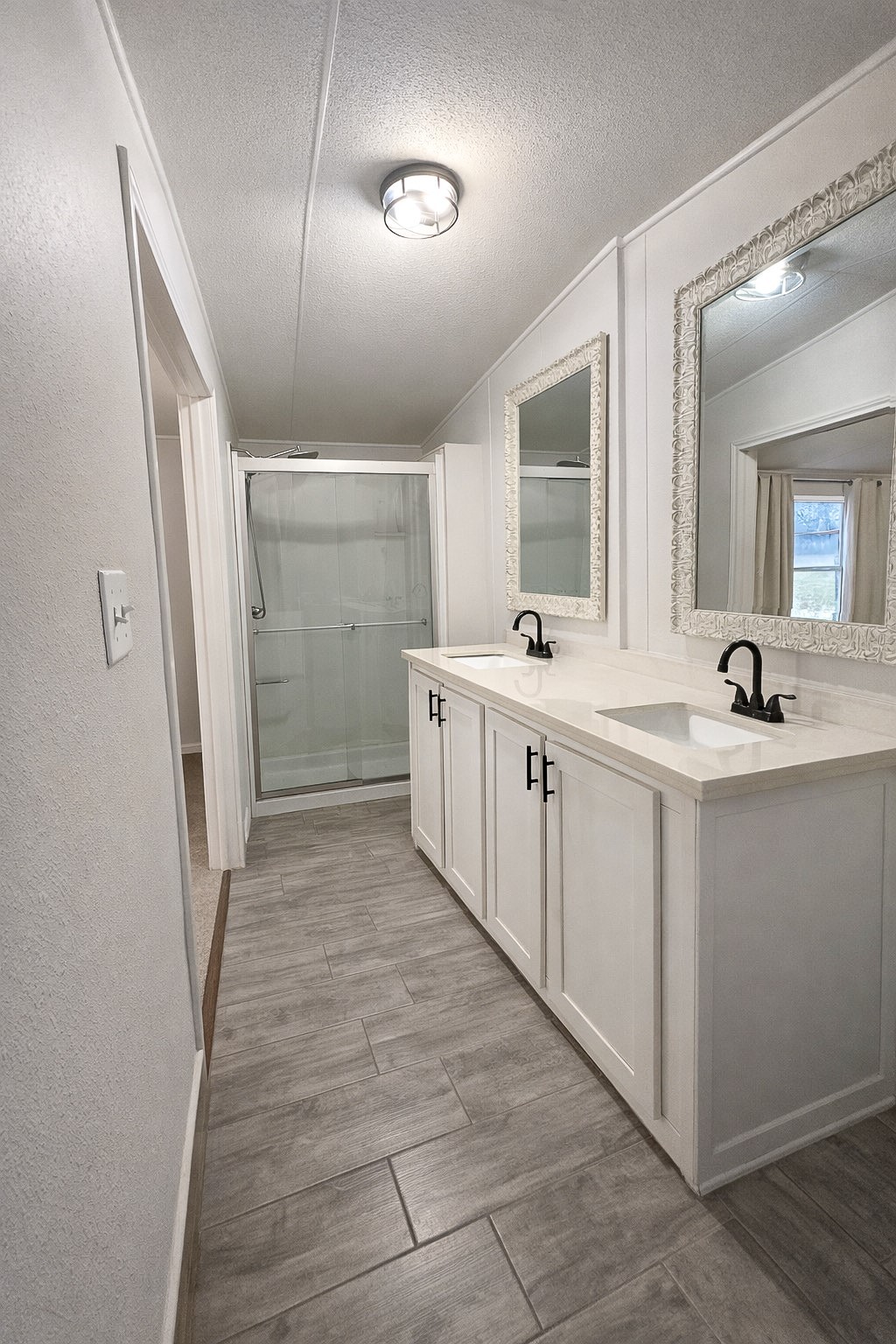 7031 Red Rock Road Franklin, TX 77856 - Photo 10 of 17 a view of a bathroom with mirror and a sink