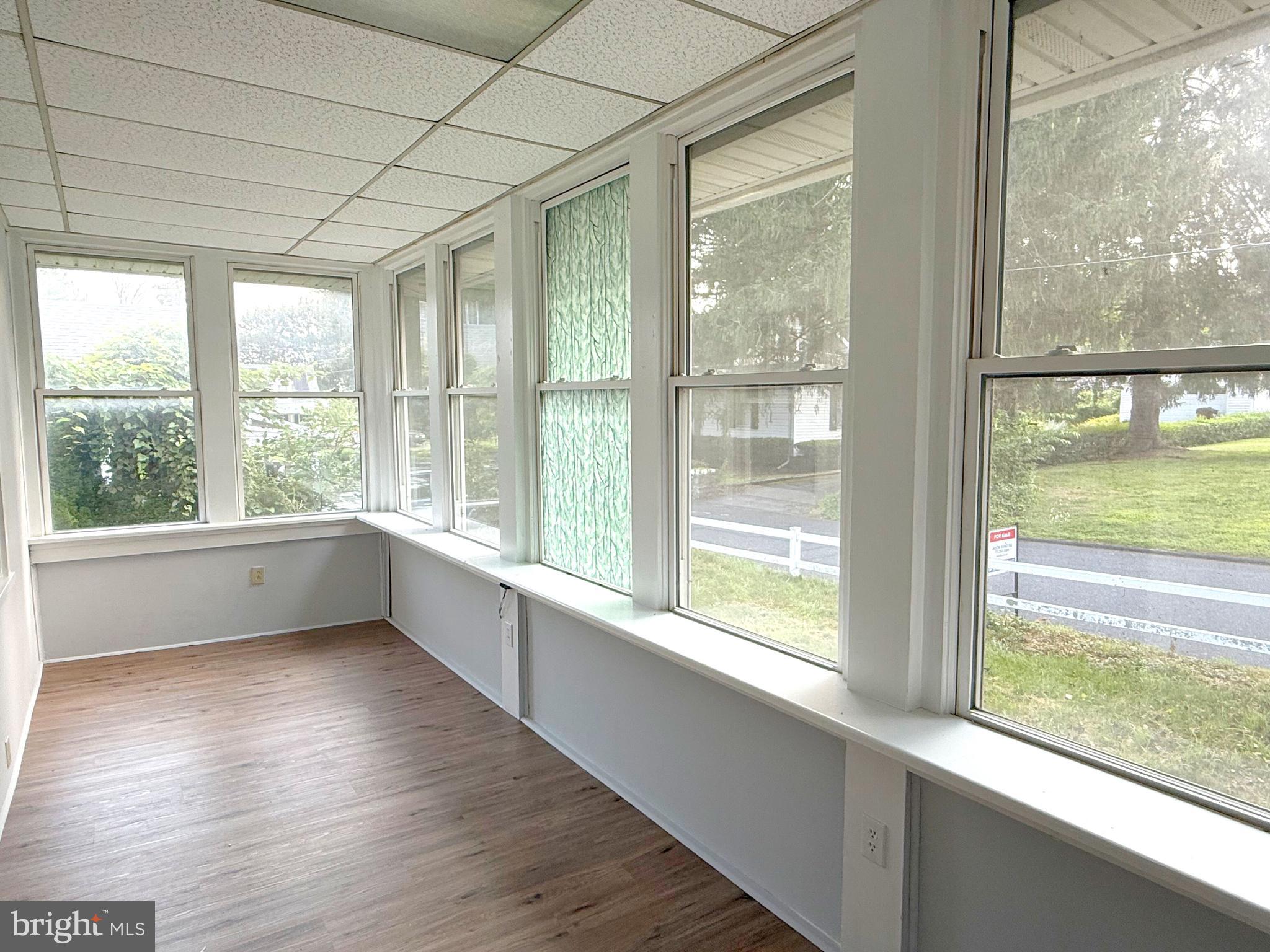13579 Summit Avenue Blue Ridge Summit, PA 17214 - Photo 3 of 18 a view of an empty room with wooden floor and a window