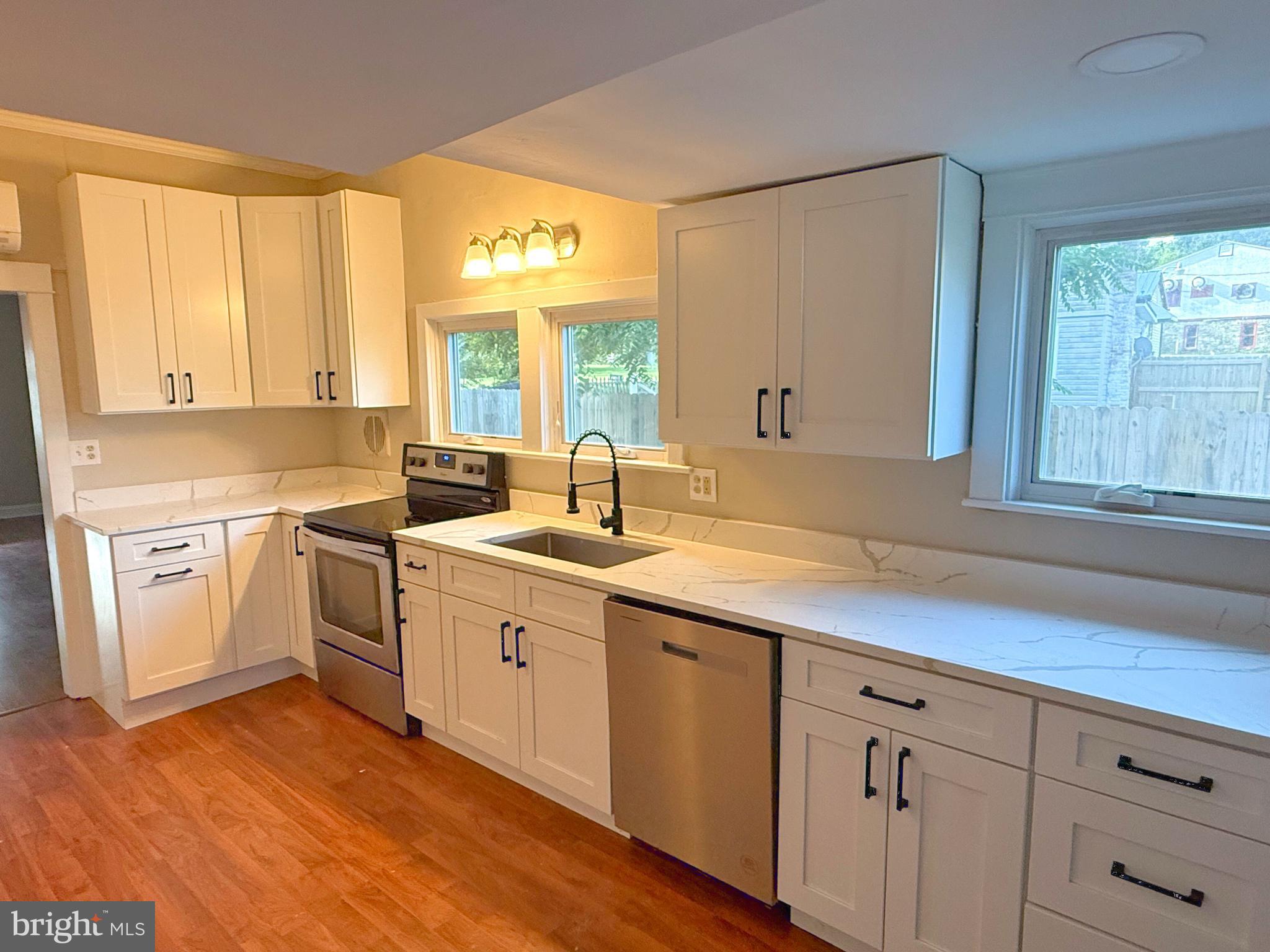 13579 Summit Avenue Blue Ridge Summit, PA 17214 - Photo 8 of 18 a kitchen with a sink stove and cabinets