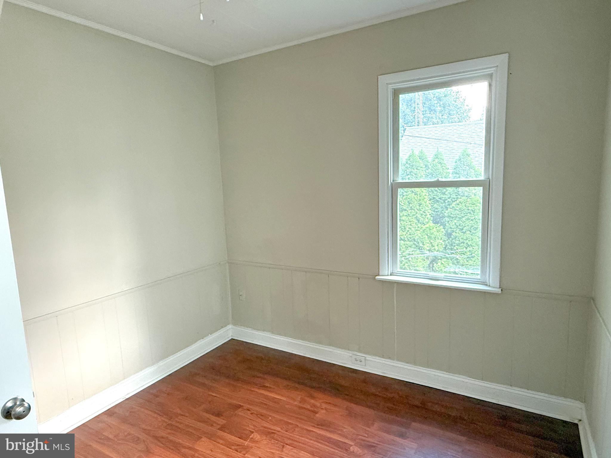 13579 Summit Avenue Blue Ridge Summit, PA 17214 - Photo 10 of 18 an empty room with wooden floor and windows