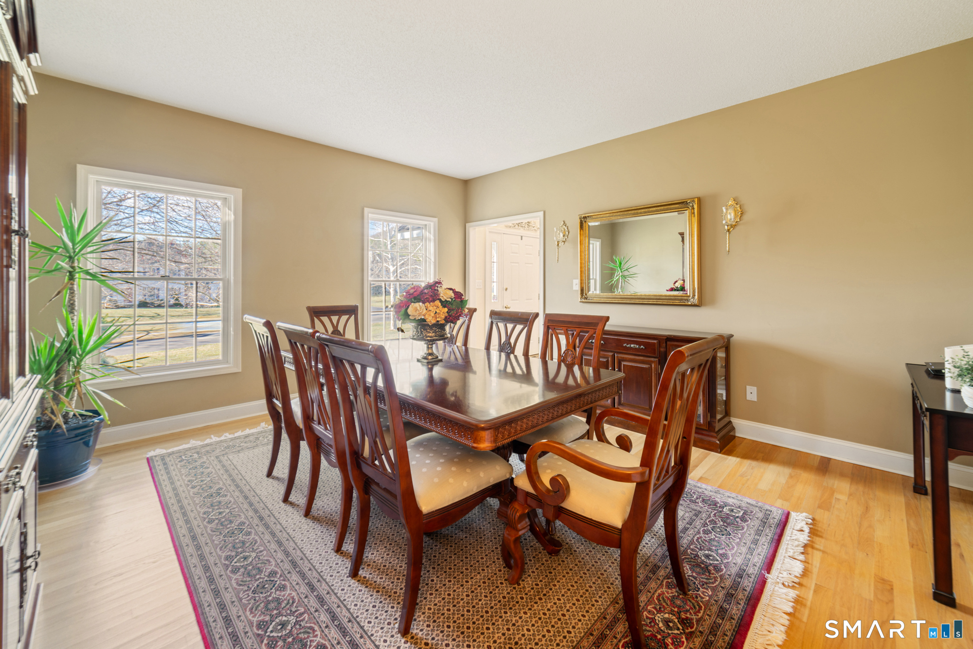 23 Mountain Pond Road Southington, CT 06489 - Photo 12 of 39 a dining room with furniture and wooden floor