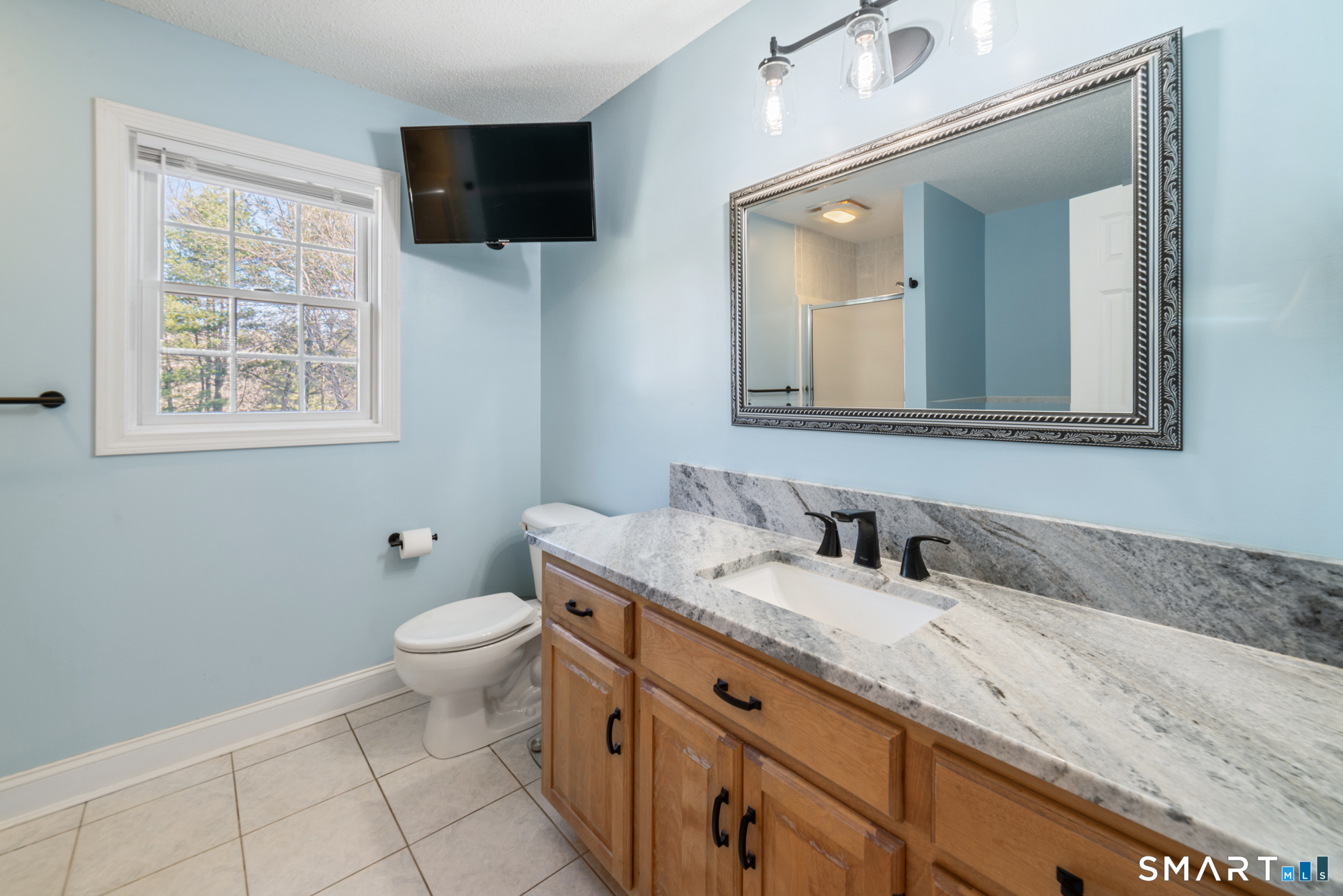 23 Mountain Pond Road Southington, CT 06489 - Photo 21 of 39 a bathroom with a granite countertop toilet sink and mirror
