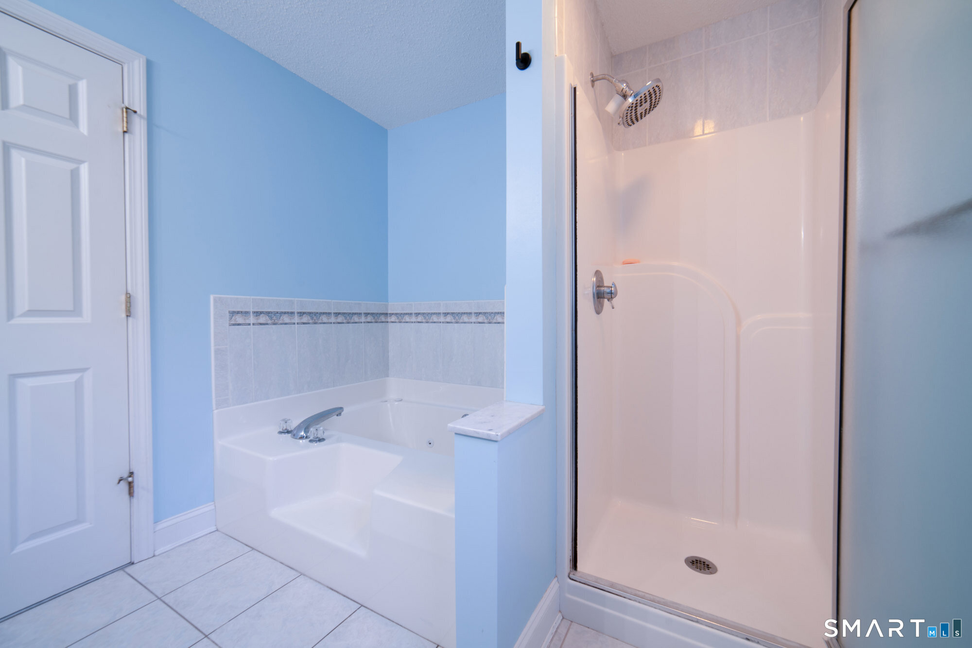 23 Mountain Pond Road Southington, CT 06489 - Photo 22 of 39 a bathroom with a bathtub and shower