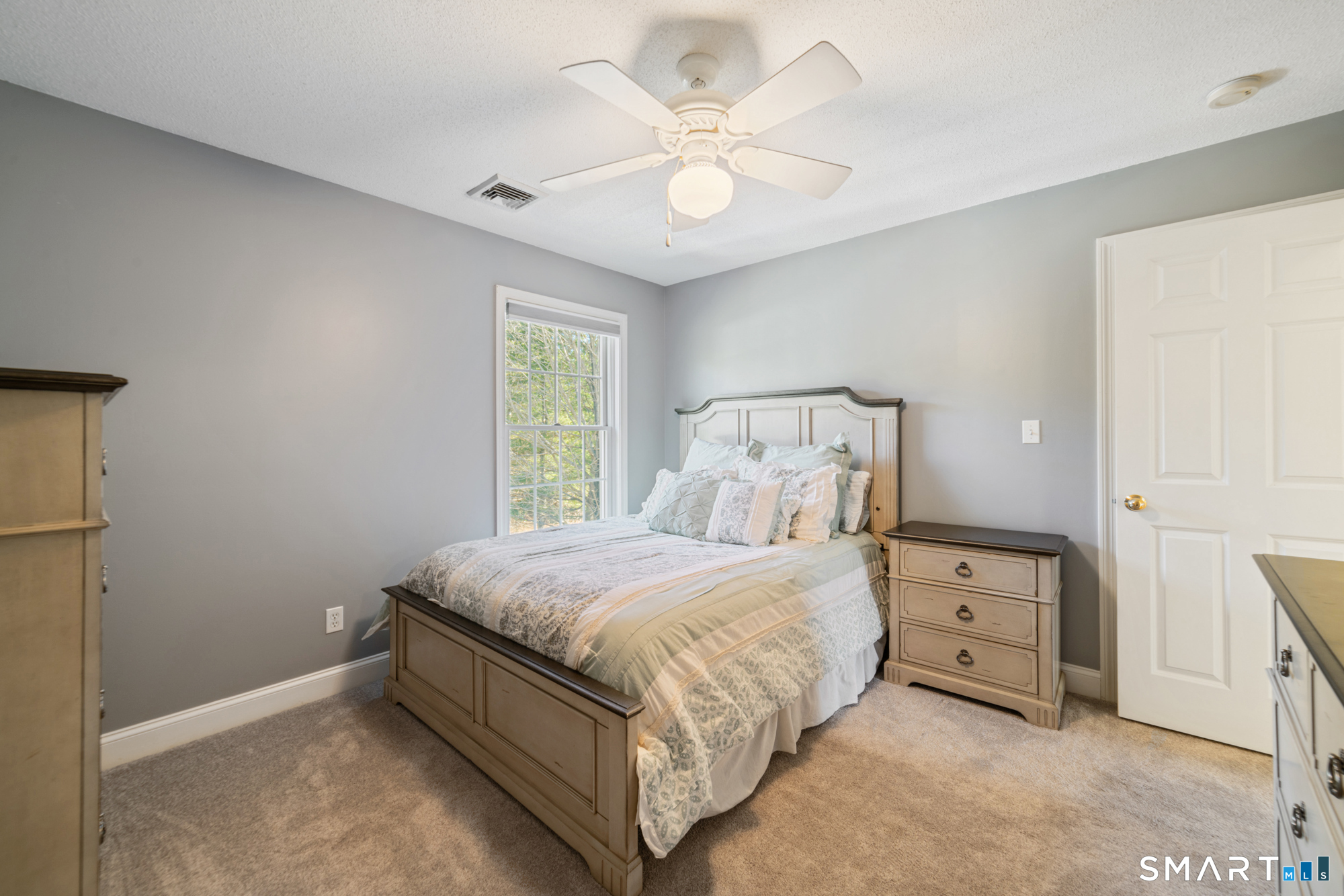 23 Mountain Pond Road Southington, CT 06489 - Photo 23 of 39 a bedroom with a bed and a ceiling fan