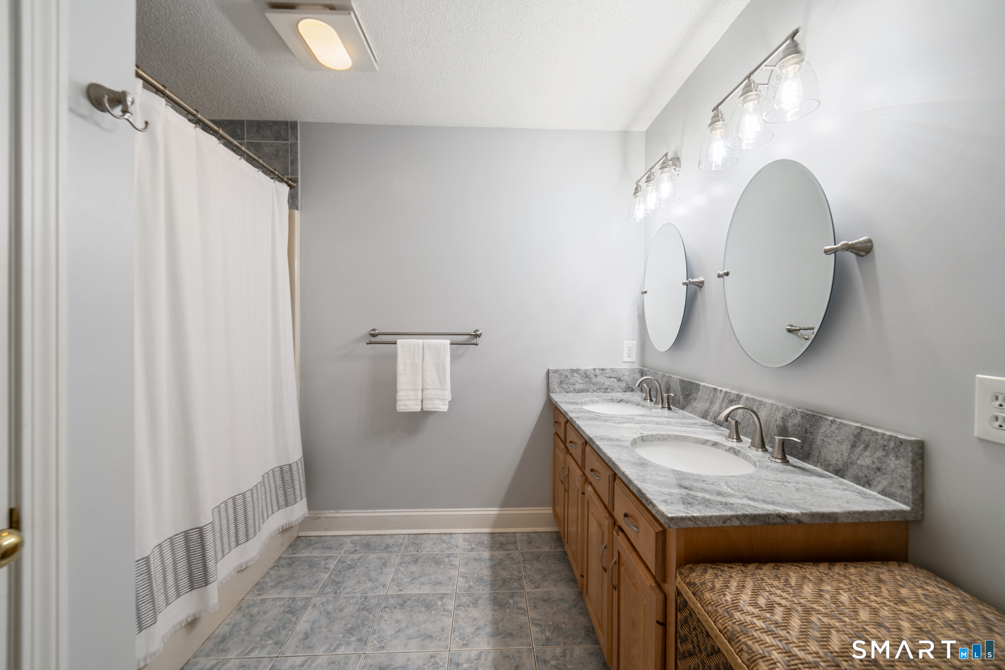 23 Mountain Pond Road Southington, CT 06489 - Photo 28 of 39 a bathroom with a double vanity sink and a mirror