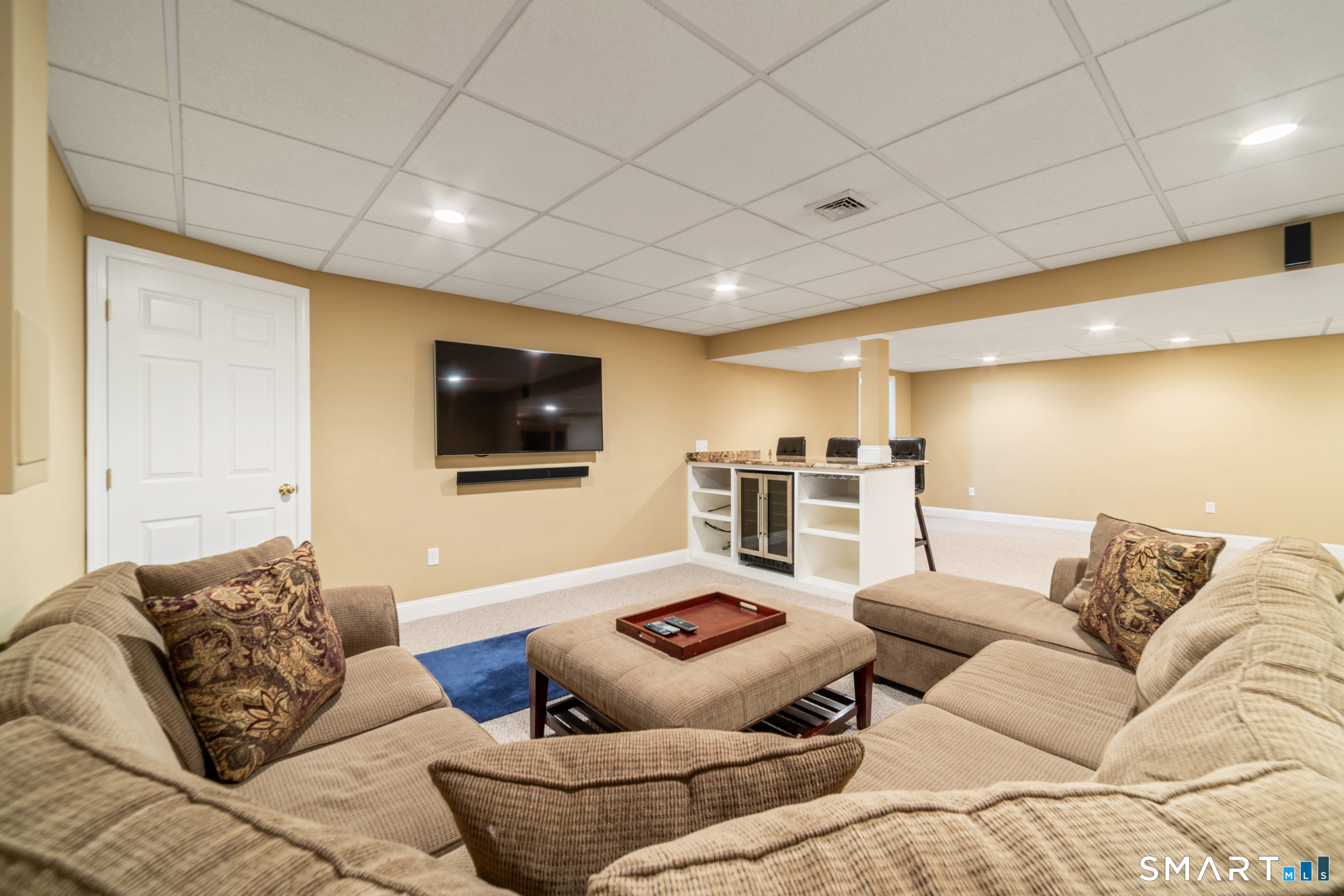 23 Mountain Pond Road Southington, CT 06489 - Photo 29 of 39 a living room with furniture and a flat screen tv