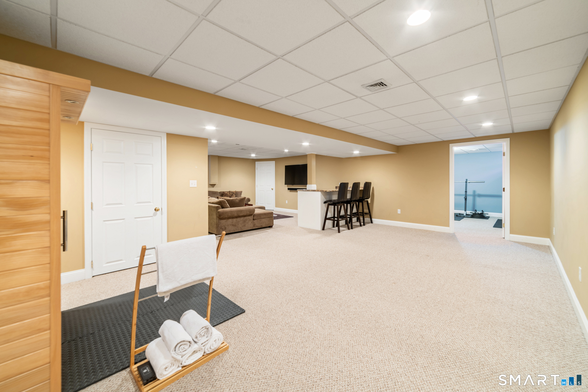 23 Mountain Pond Road Southington, CT 06489 - Photo 31 of 39 a view of a livingroom with furniture and a flat screen tv