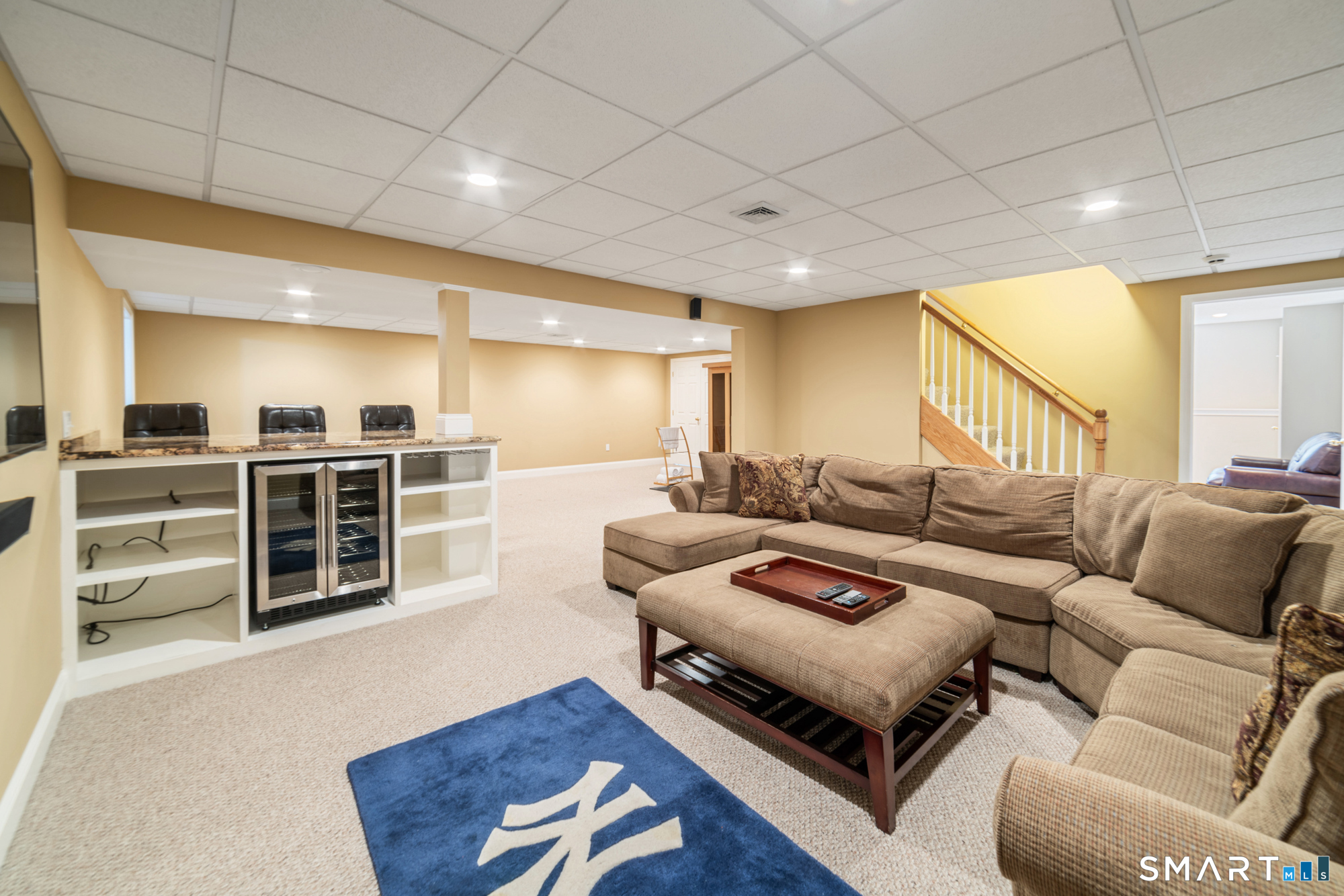 23 Mountain Pond Road Southington, CT 06489 - Photo 32 of 39 a living room with furniture a wooden floor and kitchen view