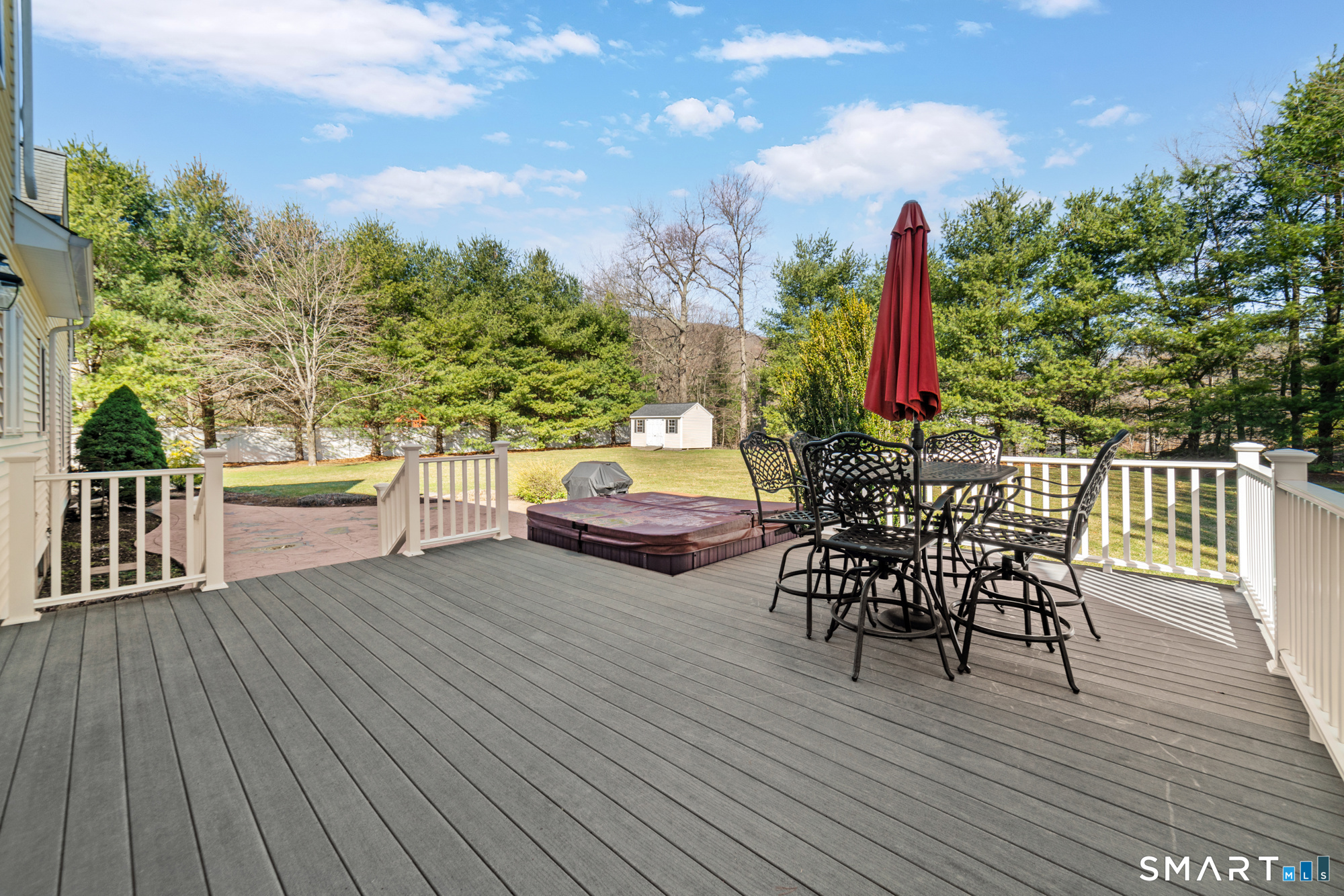 23 Mountain Pond Road Southington, CT 06489 - Photo 36 of 39 a view of a roof deck with table and chairs a barbeque with wooden floor and fence
