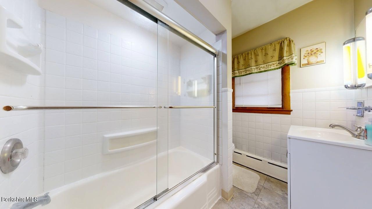 16 Anthony Street Adams, MA 01220 - Photo 14 of 33 a bathroom with a bathtub and a shower