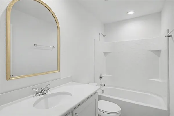 a bathroom with a sink toilet and a bathtub